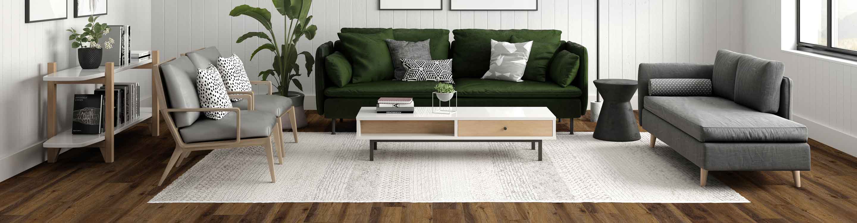 green and gray furniture in a living room with hardwood floor and a beige area rug